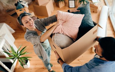 Above view of happy couple moving into their new home.